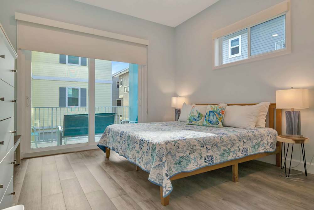 Bedroom with balcony access and natural light