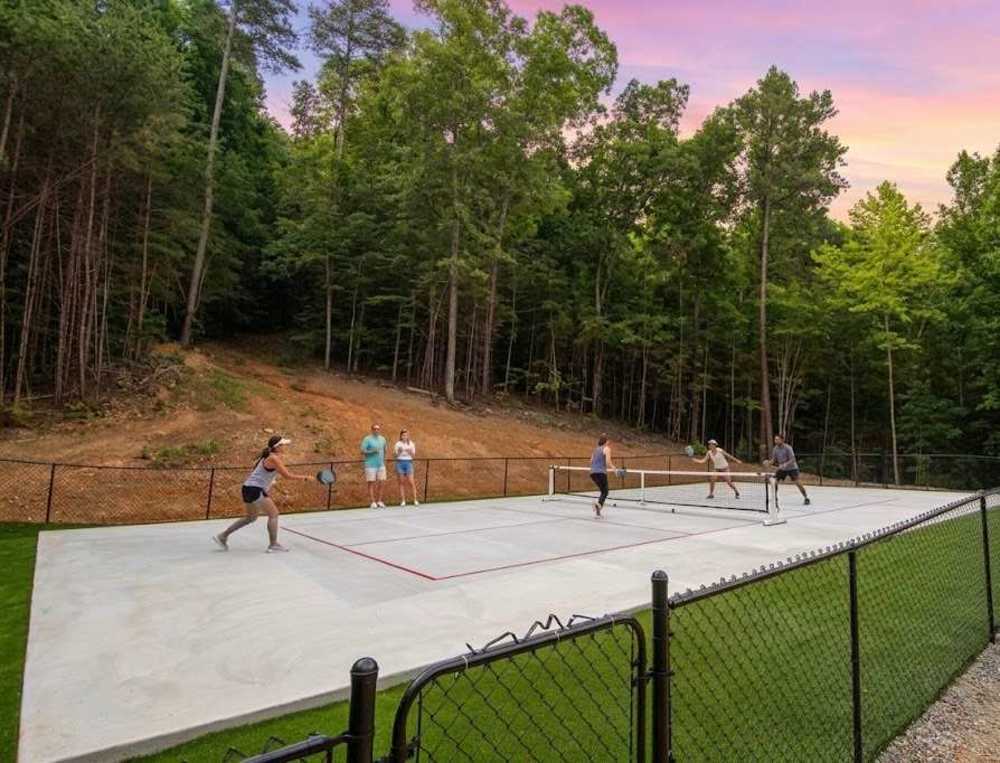 The communal pickleball court is a short drive from Treetop Escapes