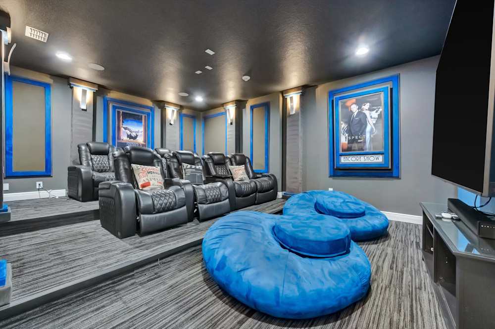 Dedicated theater room with reclining cinema seating