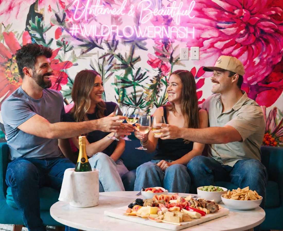Friends toasting in the WildFlower condo in Nashville