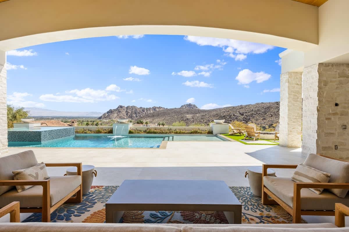 Sip morning coffee on the covered terrace overlooking your private infinity pool.