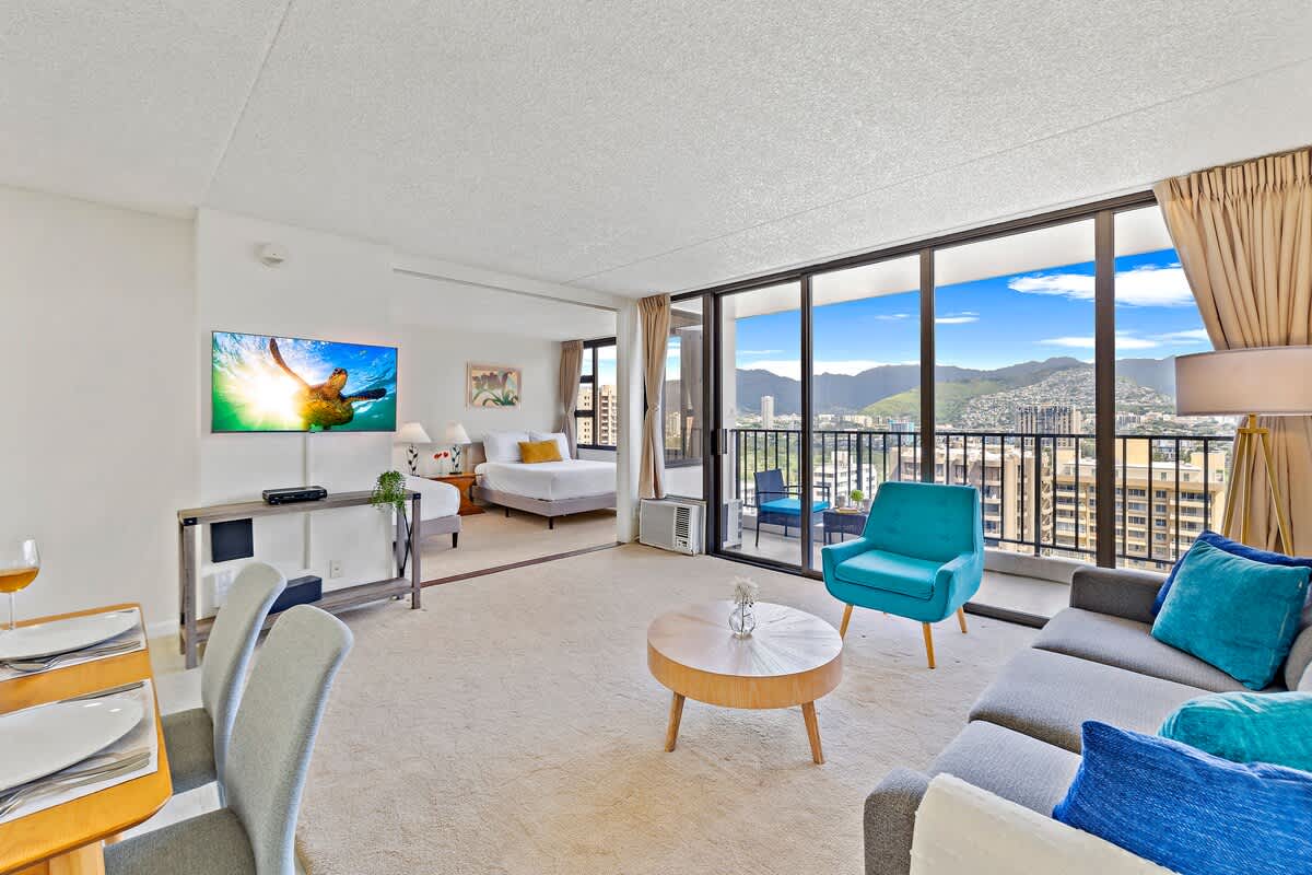 Living room with window AC. Cable TV