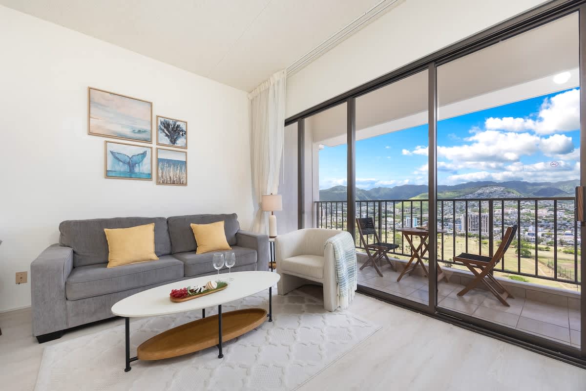 1BR unit with a pull-out sleeper sofa in the living room and great mountain views