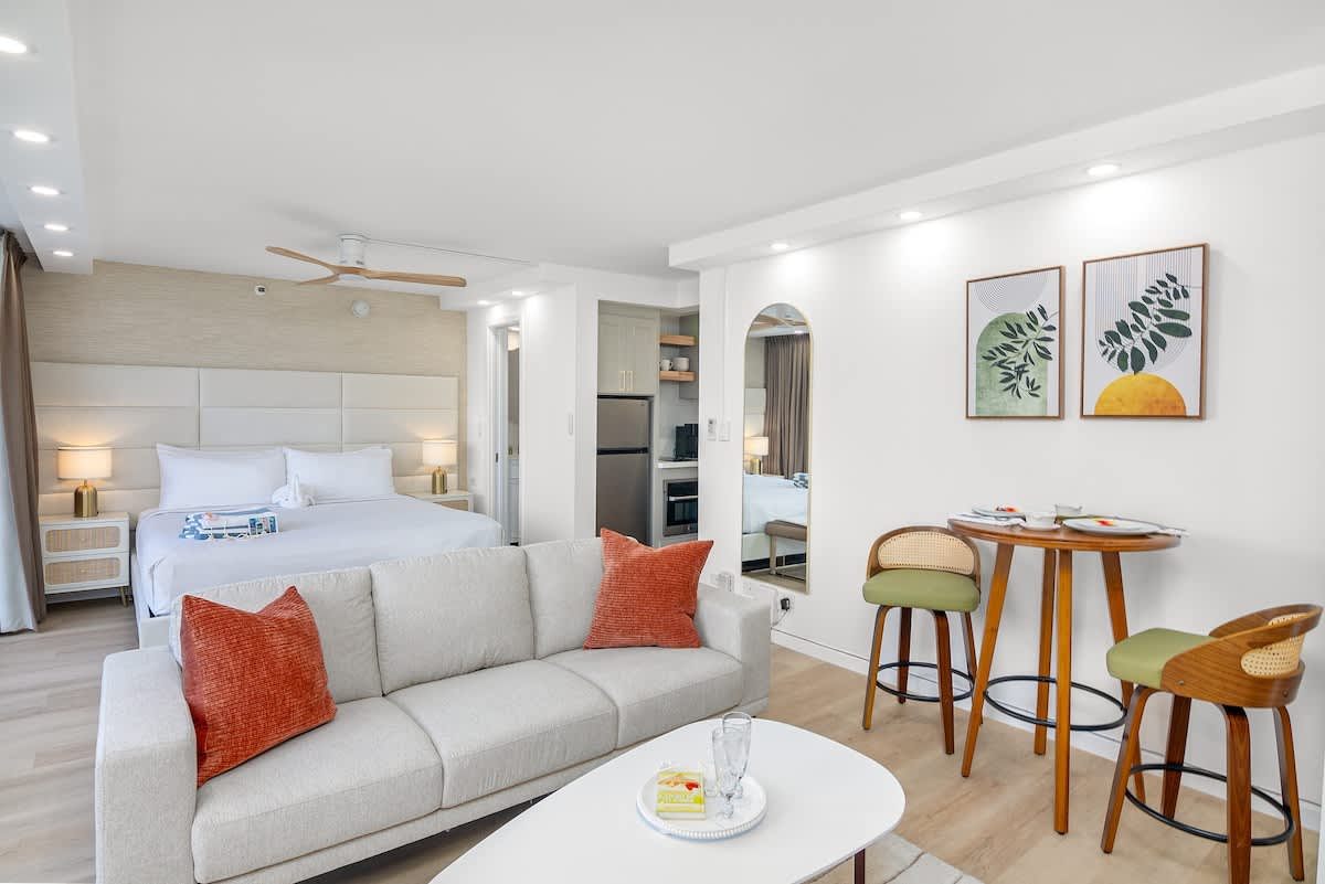 Your living area with a regular new sofa, and a coffee table. The dining area with a table and 2 chairs.