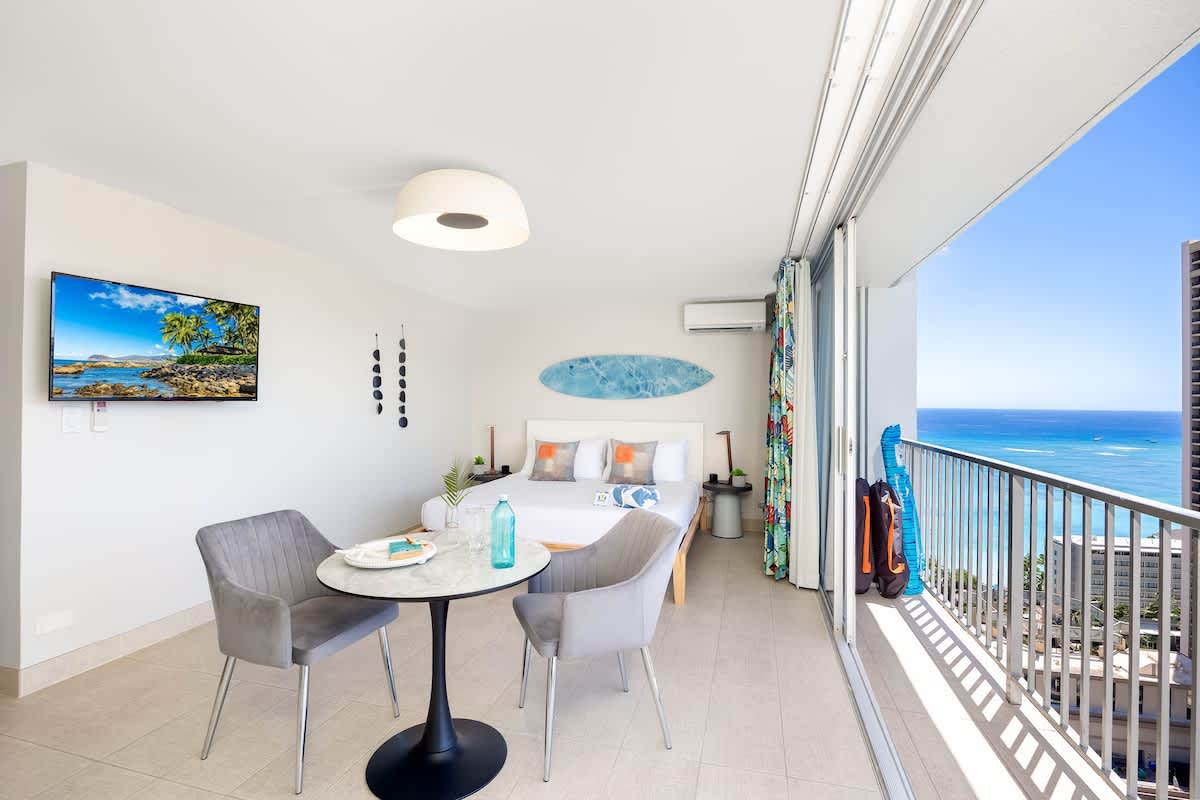 Indulge in this vibrant studio, featuring a king-size bed, breathtaking ocean views from your private balcony, and we provide 2 beach chairs and an umbrella for your perfect beach day!