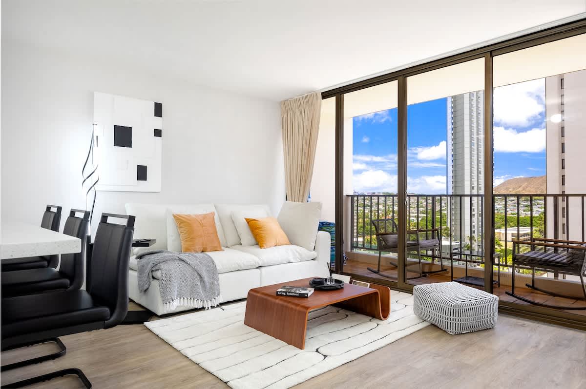 Your perfect retreat awaits, offering an inviting living room with direct balcony access, ideal for unwinding after a day of exploration.