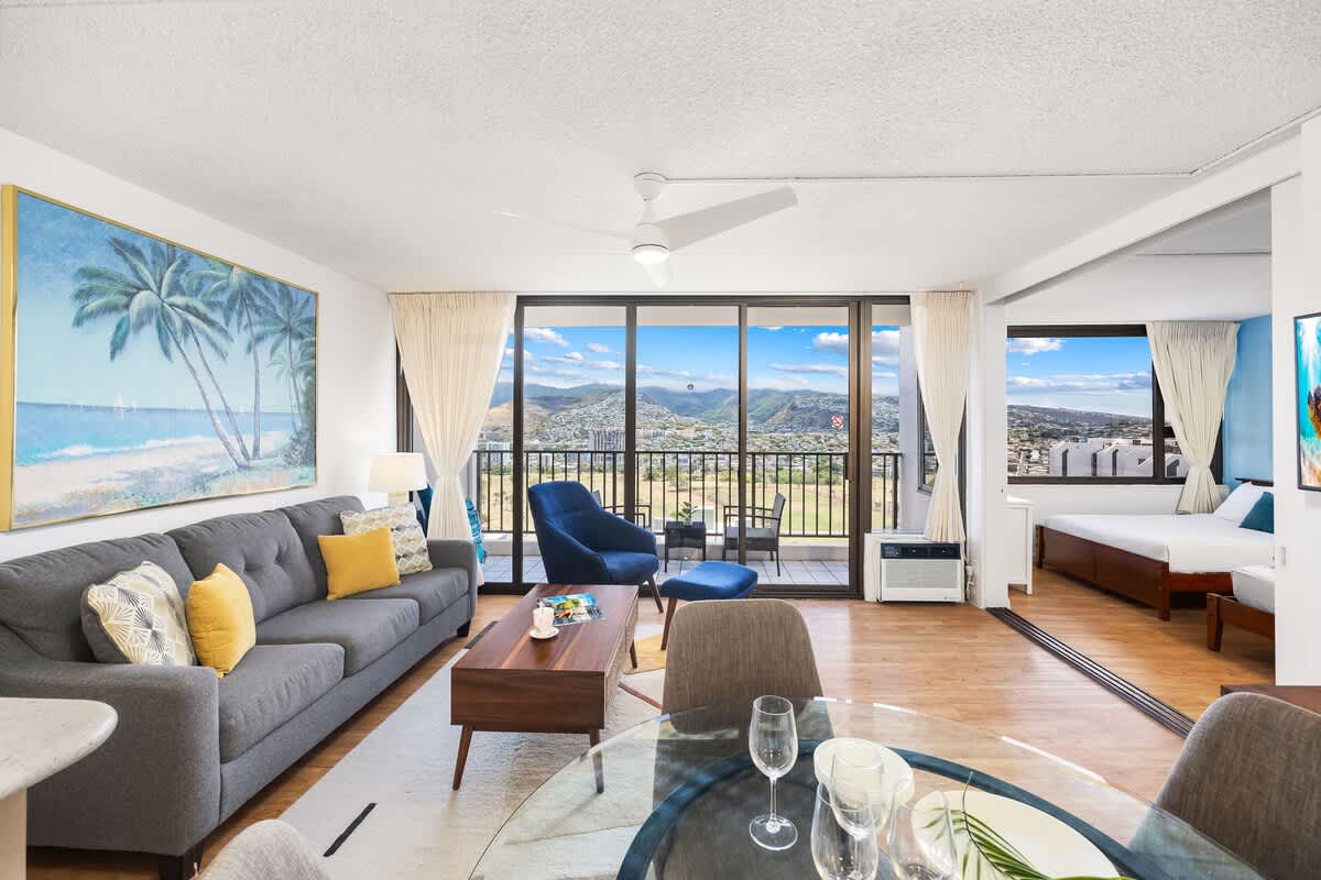 Relax and enjoy breathtaking mountain views from your pull-out sleeper sofa in this modern living space.