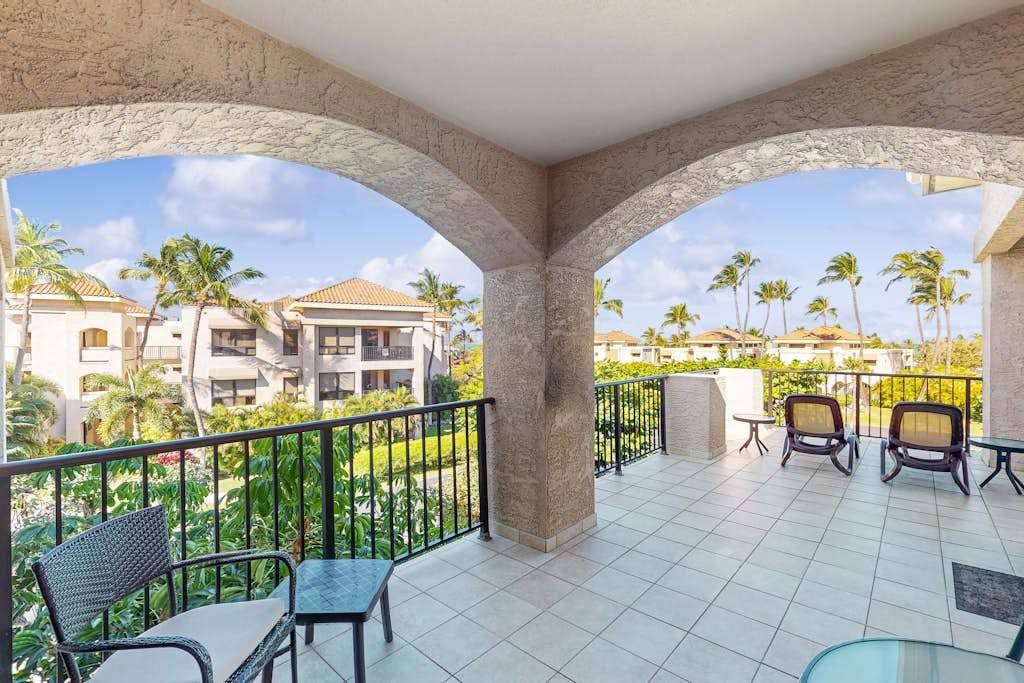 Covered Arched Balcony with Seating & Resort Views 