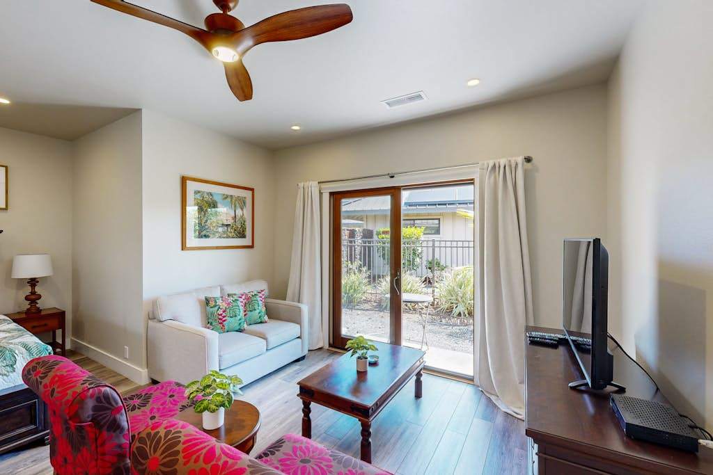 Bright Studio Living Space with Seating Area & Sliding Patio Doors