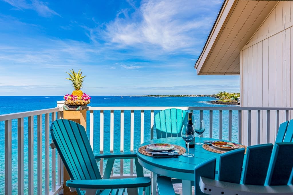 Private Ocean-Facing Balcony Dining Setup with Panoramic Sea Views