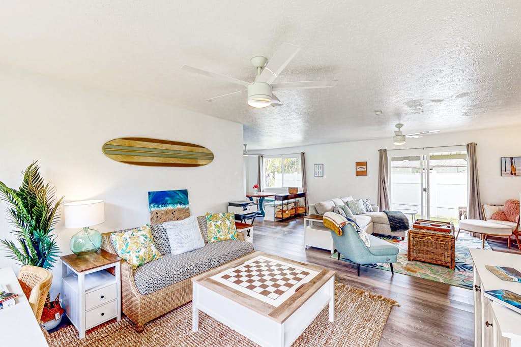 Living room with plenty of seating for relaxing on the sofa bed or a table for having a game night. 