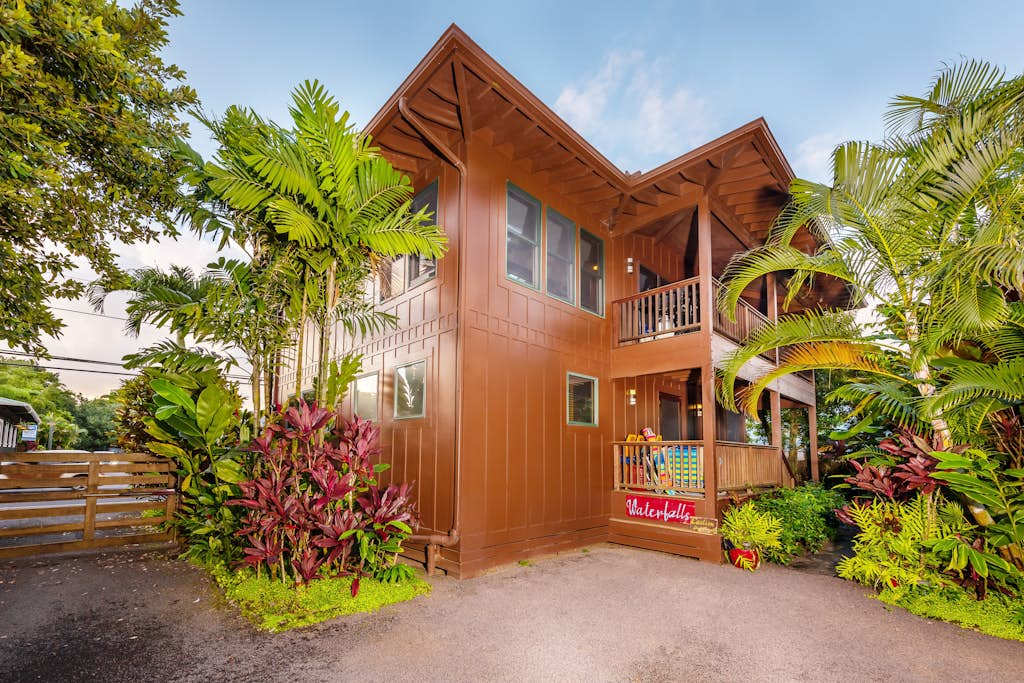 Wooden home exterior blends landscaping with welcoming architecture and balconies