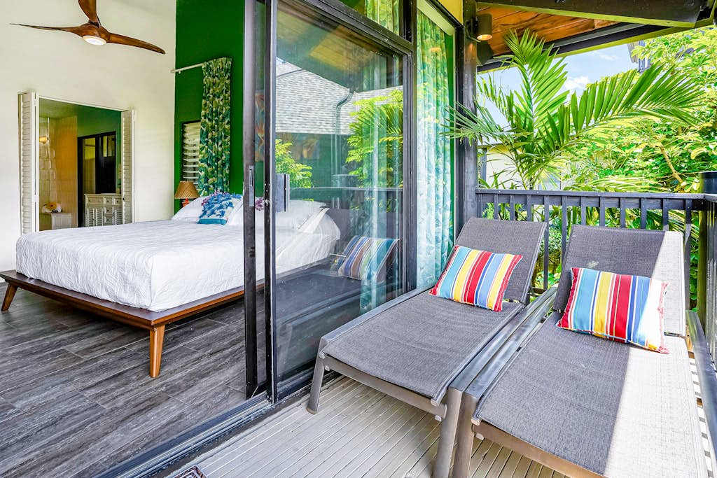 Private Covered Balcony with Sun Loungers Adjacent to Primary Bedroom