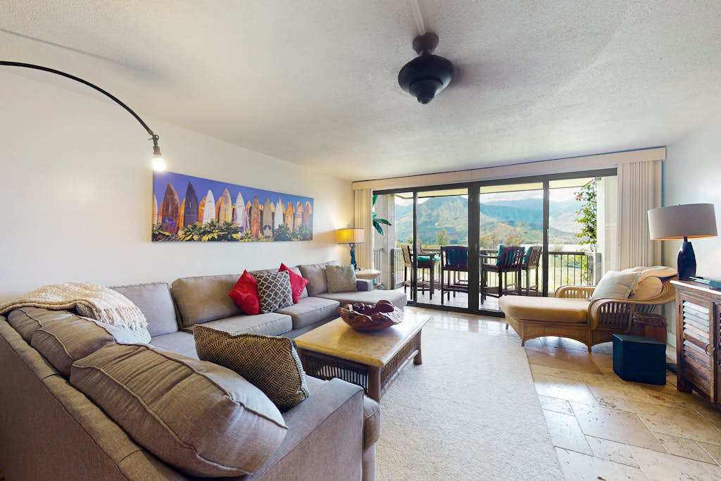 Entertainment corner pairs television timber cabinetry and cheerful accent cushions