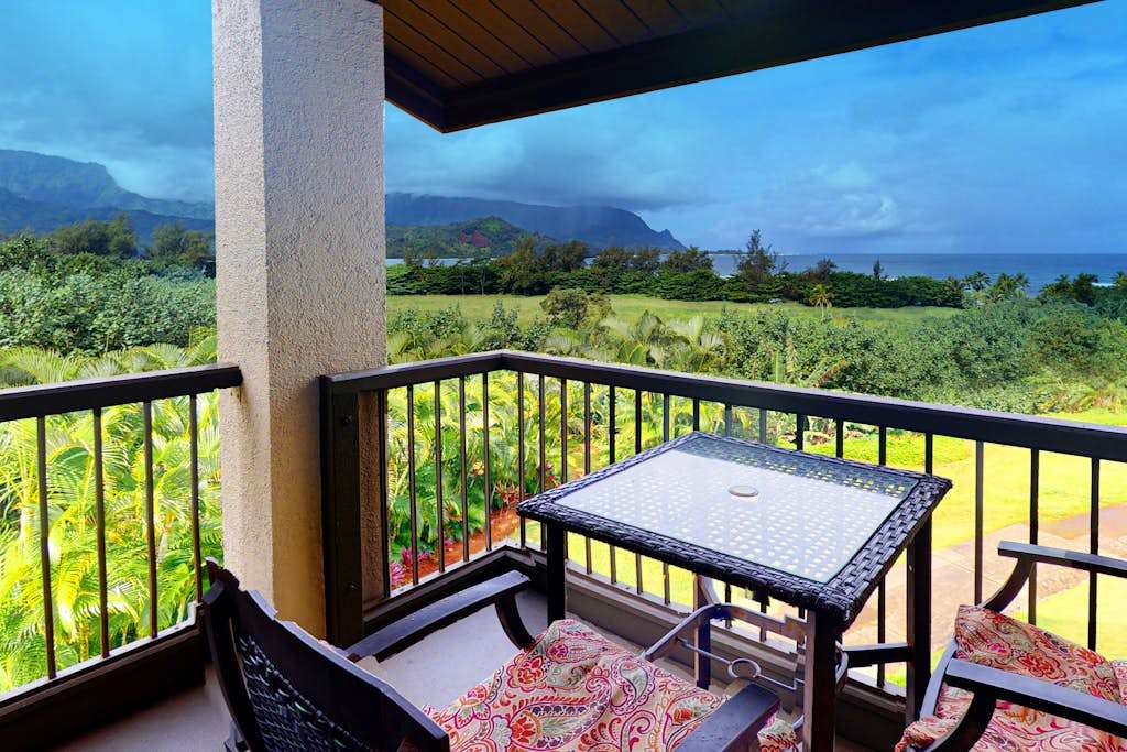 Enjoy morning coffee outside while admiring sweeping tropical island views