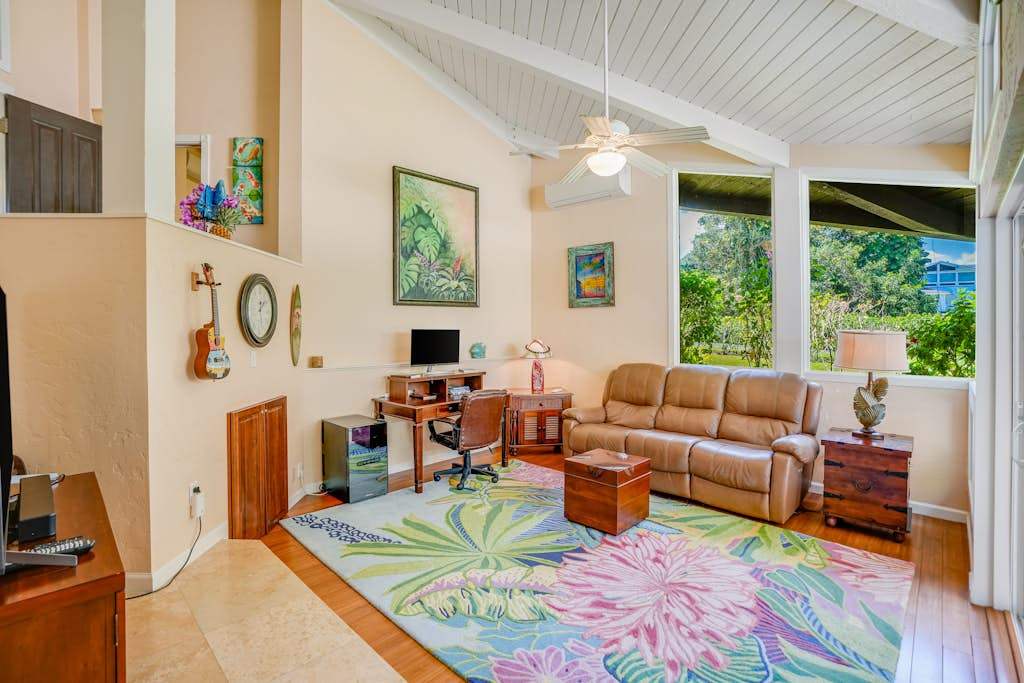 Living room with vaulted ceilings and flat screen tv.