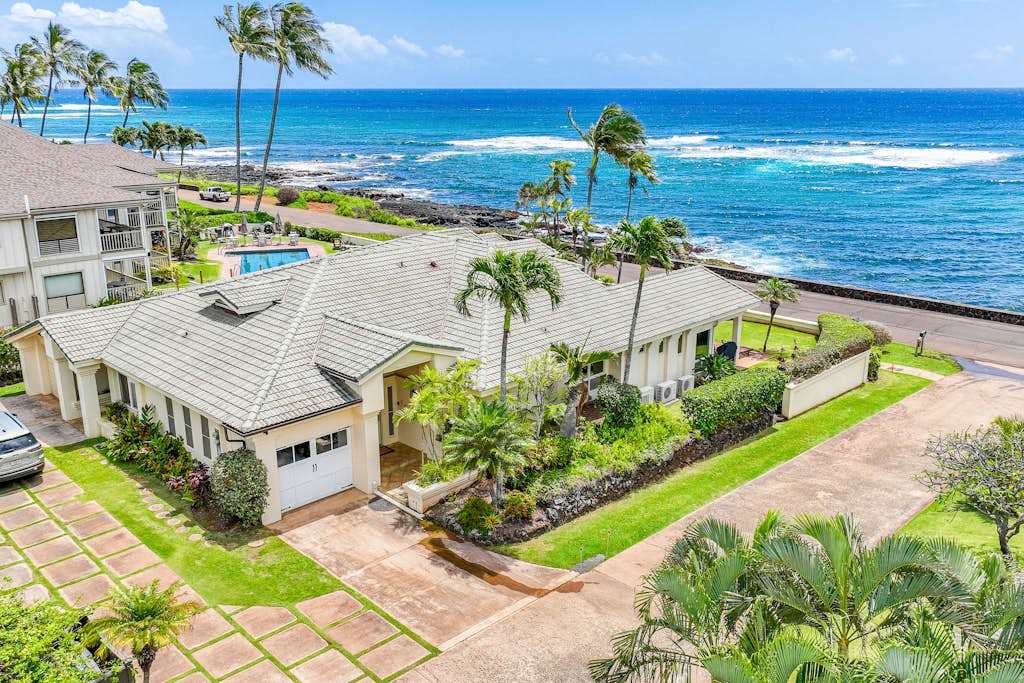 Lush tropical landscaping welcomes every arriving guest warmly