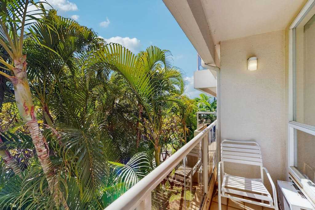 Step onto the balcony and enjoy lush tropical surroundings