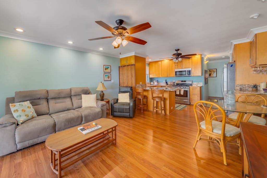 Airy living room welcomes natural light creating a warm and comfortable gathering space