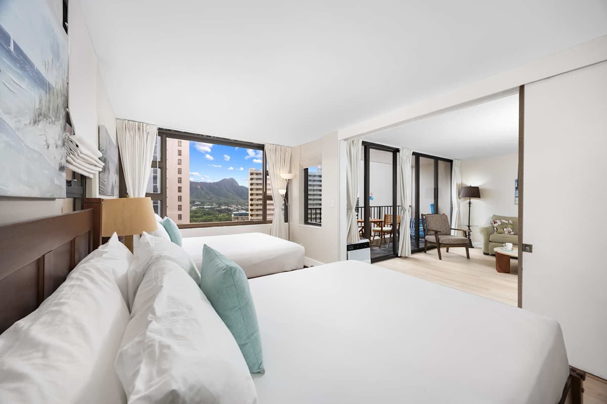 Sleep in comfort with two queen beds, bright interiors, and dreamy mountain views just beyond your windows.