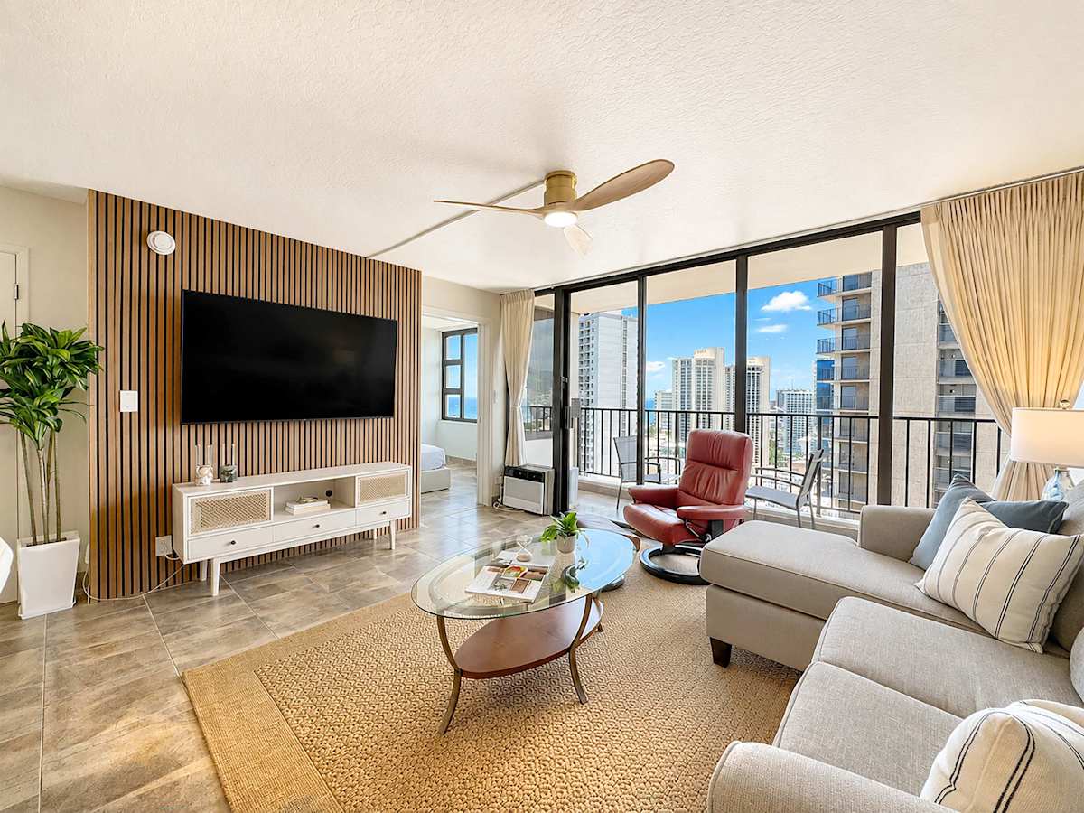 Unwind in your living area with a sectional sleeper sofa, 65" smart cable TV, ceiling fan, and a window AC.