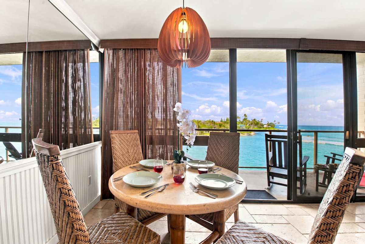 Dining Table with Ocean Views and Pendant Lighting