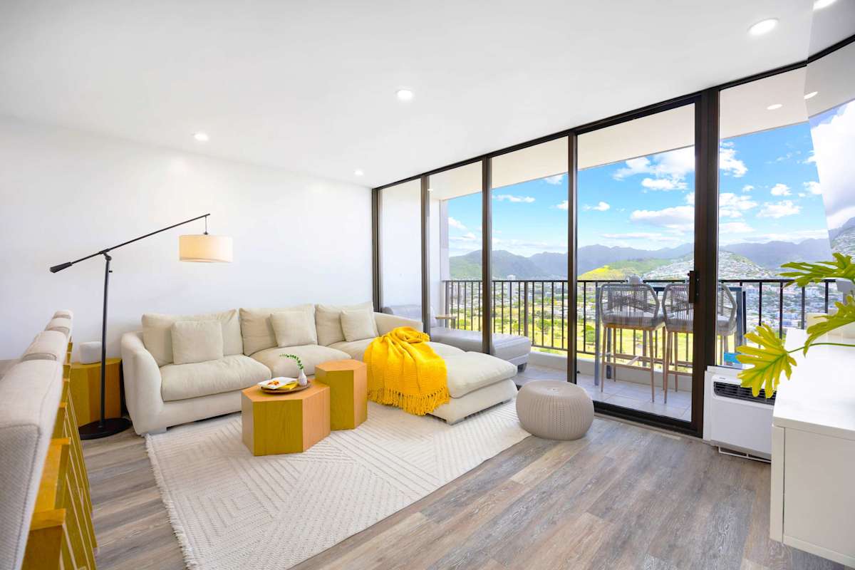 Relax in your sectional sofa in the living area, plus direct lanai access with stunning mountain and city views.
