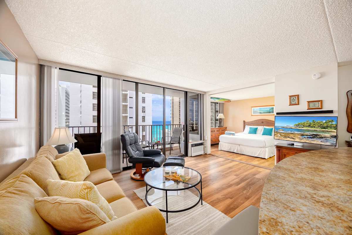 Unwind in this vibrant living space, offering breathtaking ocean views from your private balcony, a pull-out sleeper sofa, and a 40" smart TV for ultimate relaxation.