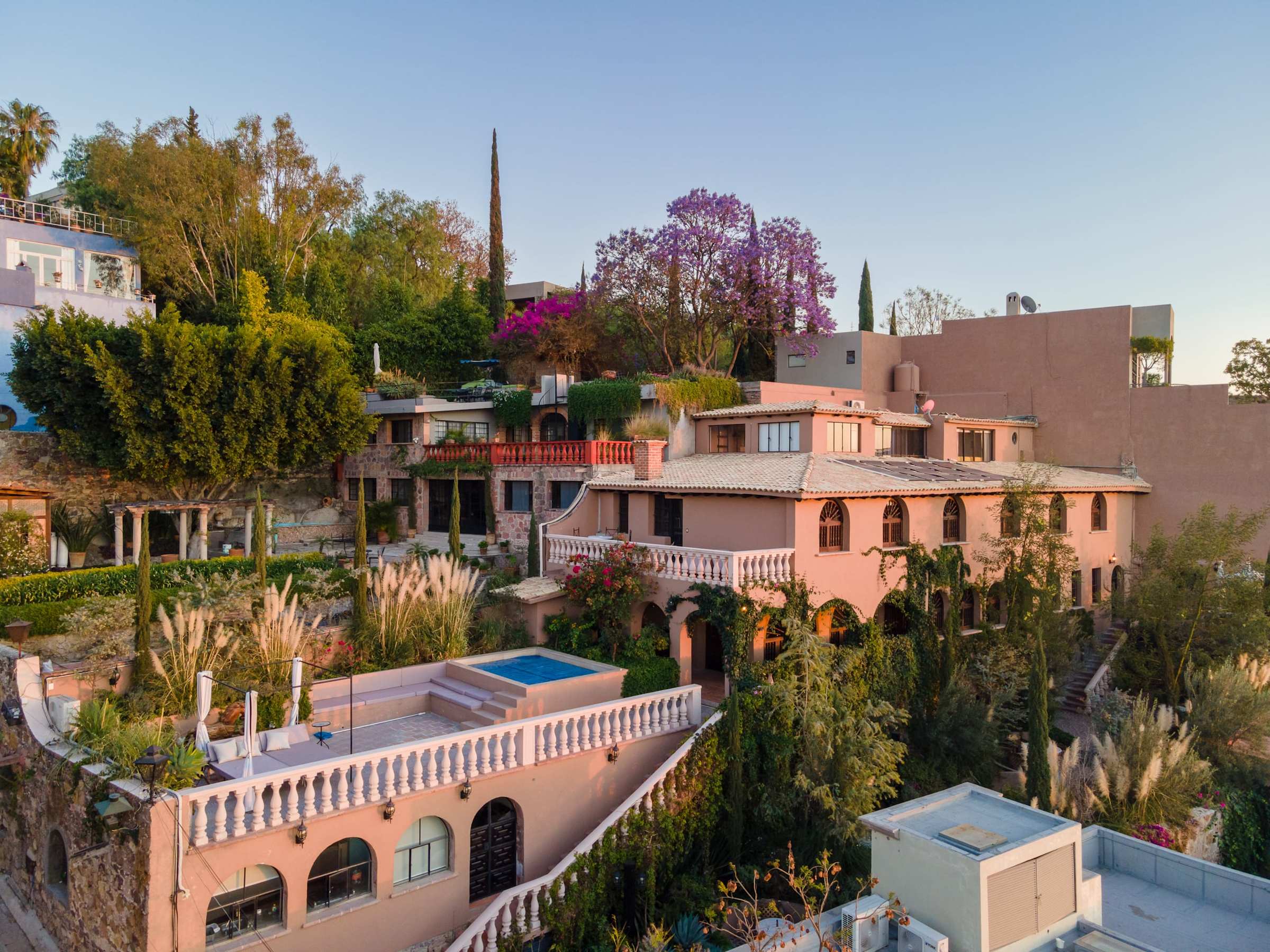 Aerial view of the villa and San Miguel rooftops at dusk