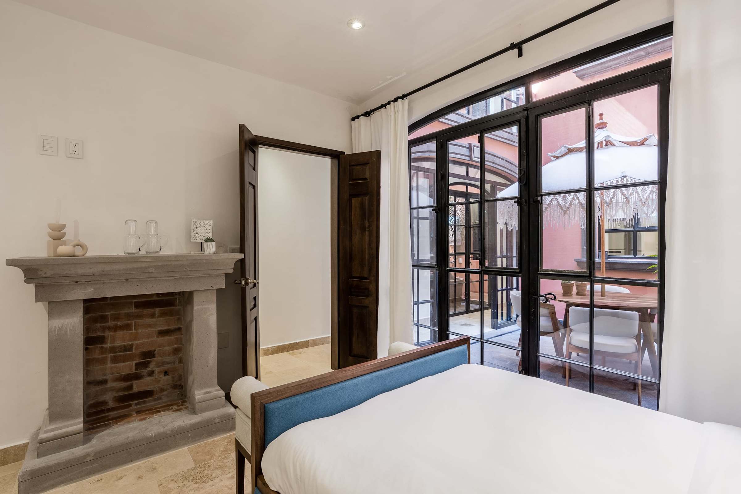 Bedroom with double beds and patio
