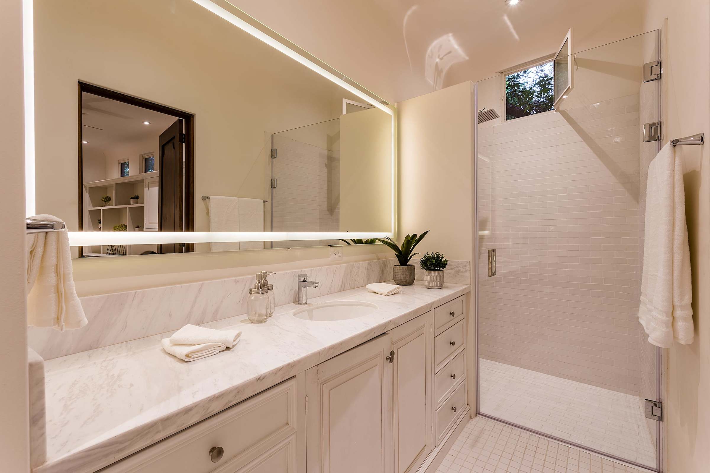 Bathroom with vanity and shower