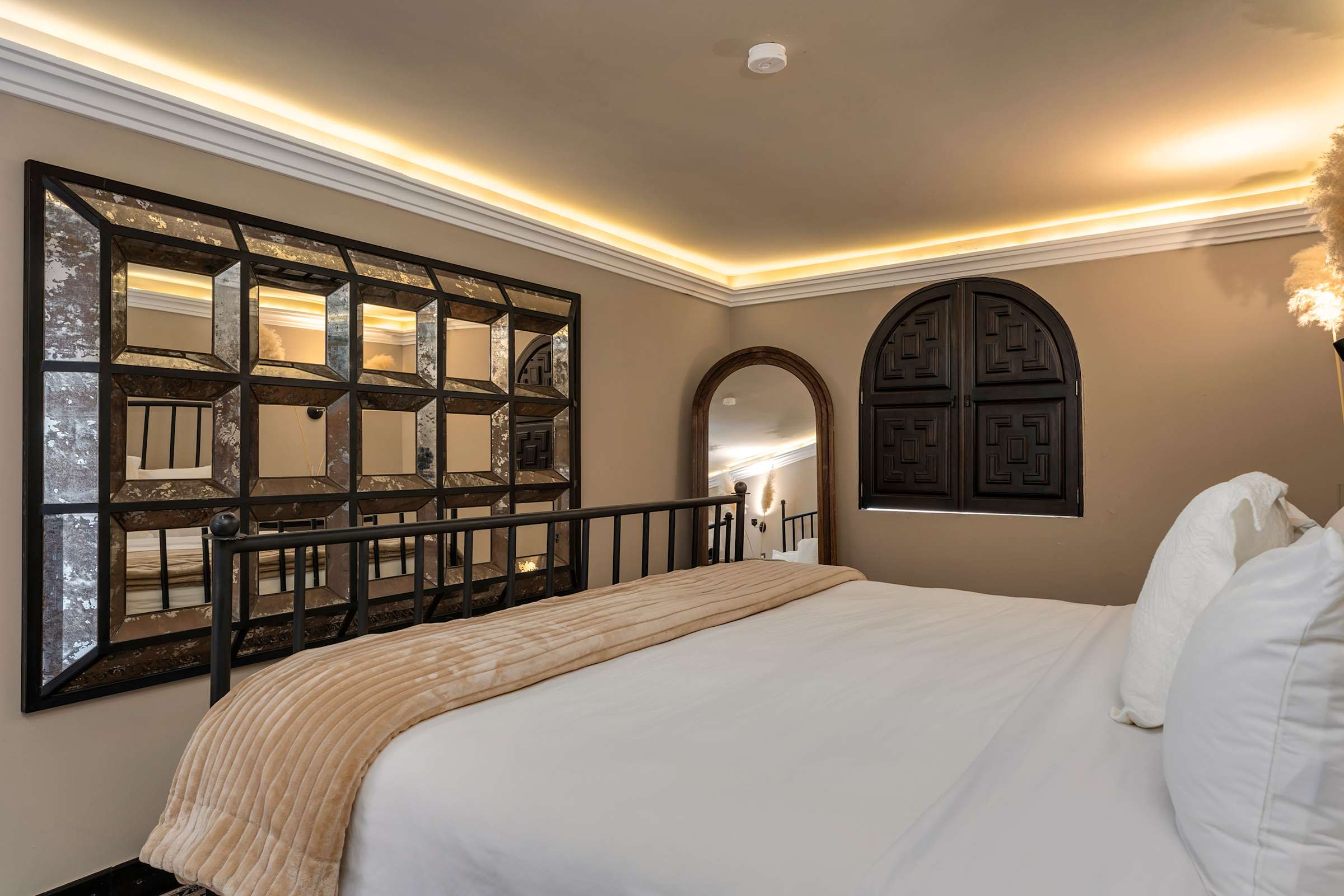 Casita king bedroom with decorated mirror detail