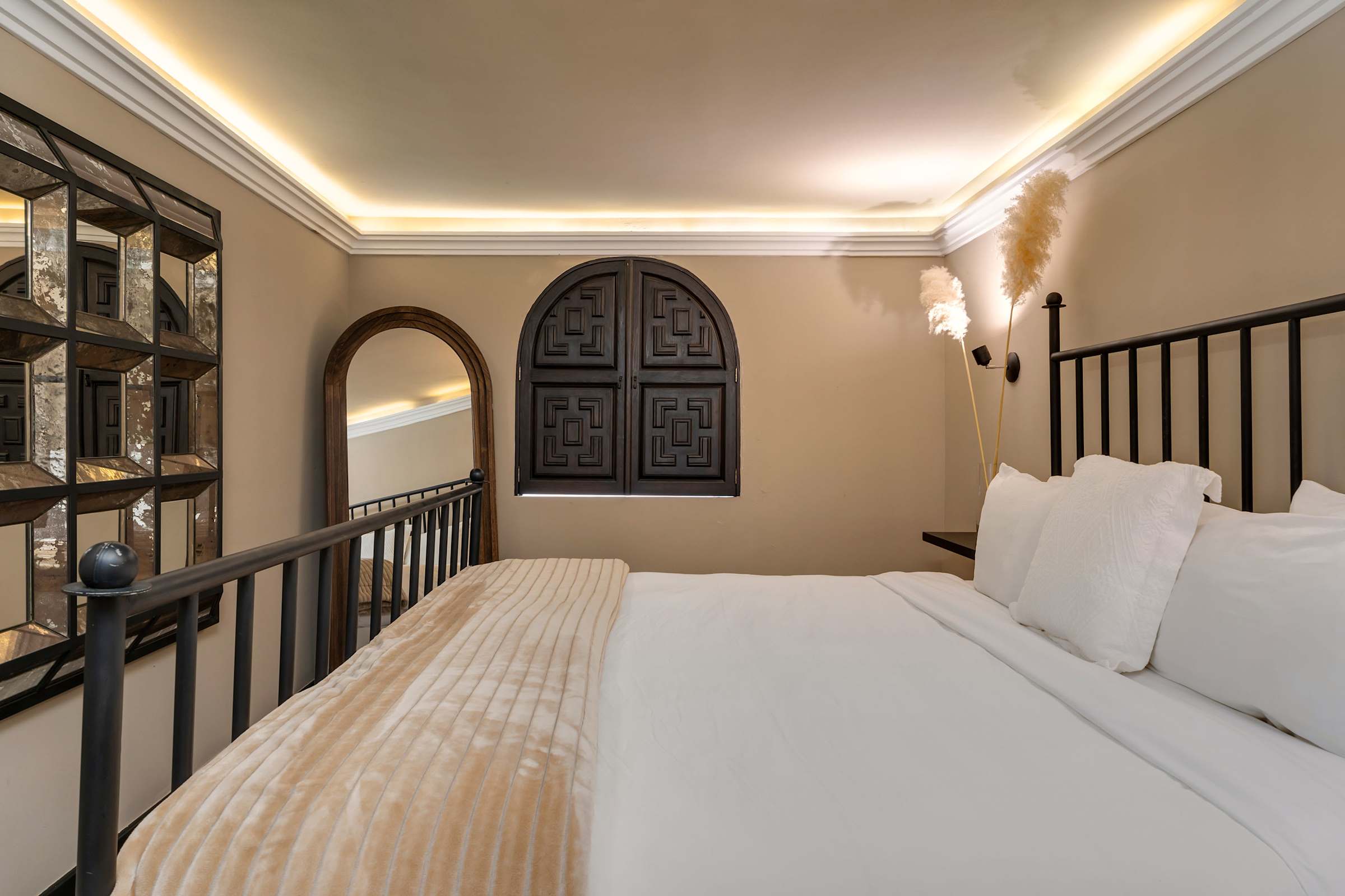 Casita king bedroom with full-length mirror