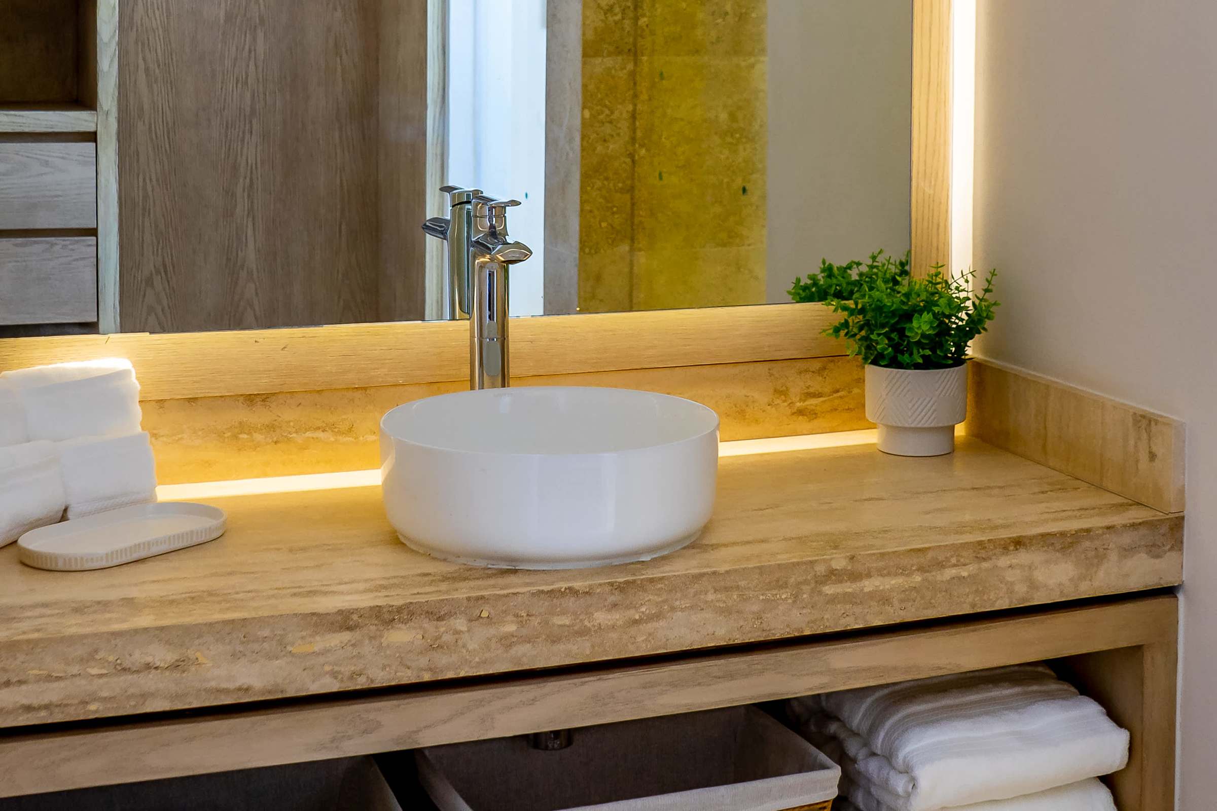 Full bathroom 3 with an illuminated stone vanity, round vessel sink, and premium toiletries