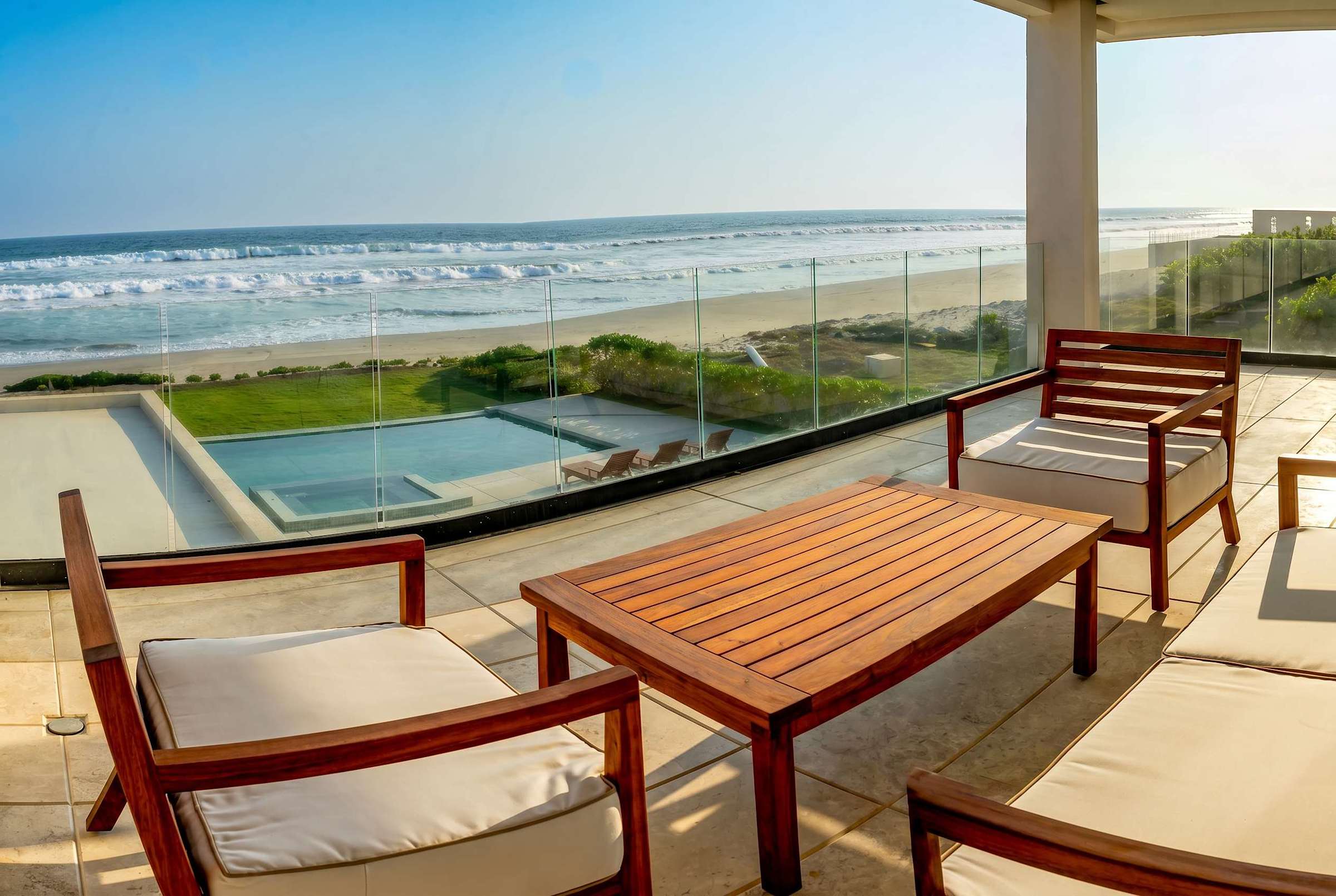 Bedroom 6 private terrace with outdoor seating, pool view, and unobstructed ocean vista — your personal outdoor paradise