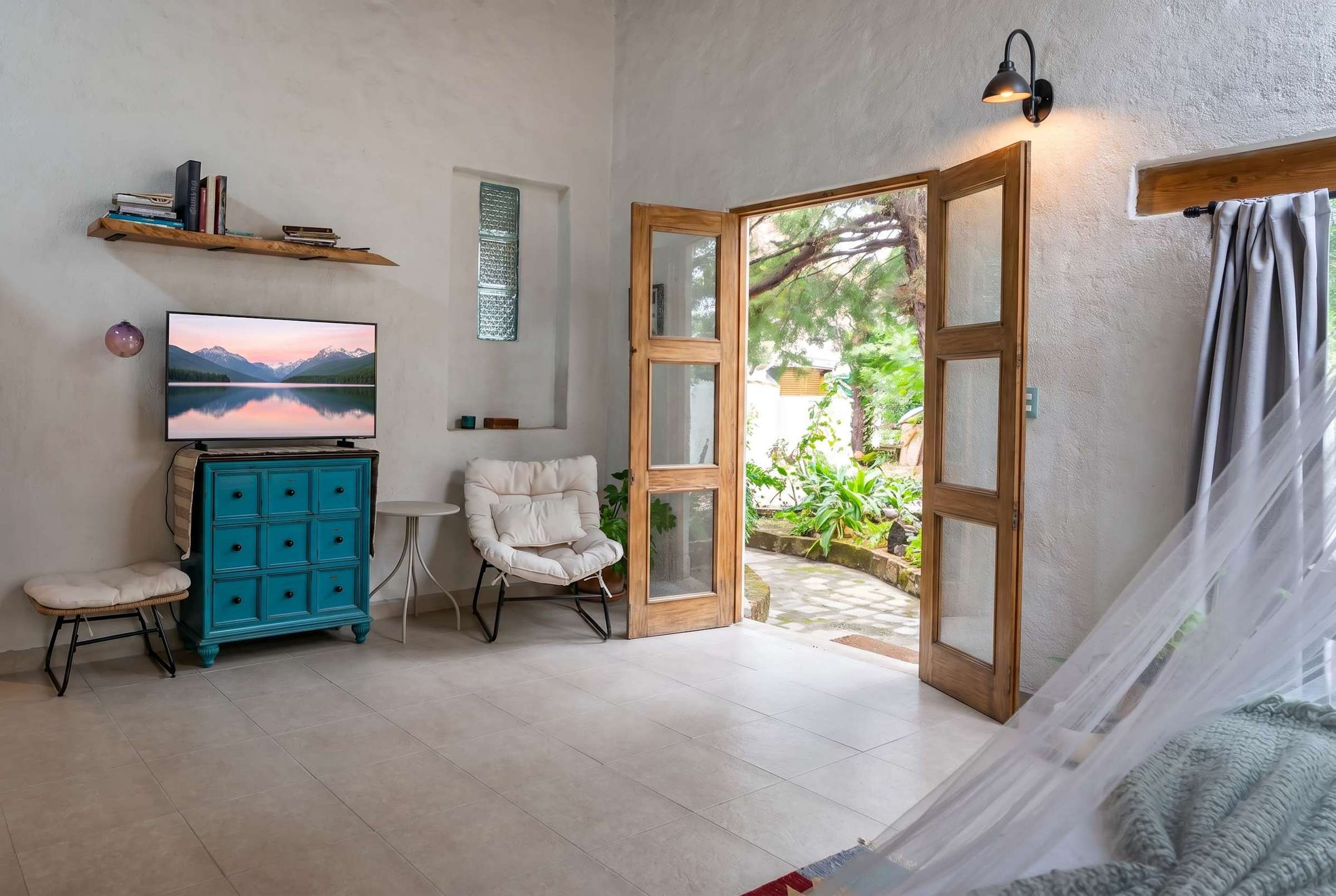 Bedroom with TV and garden access
