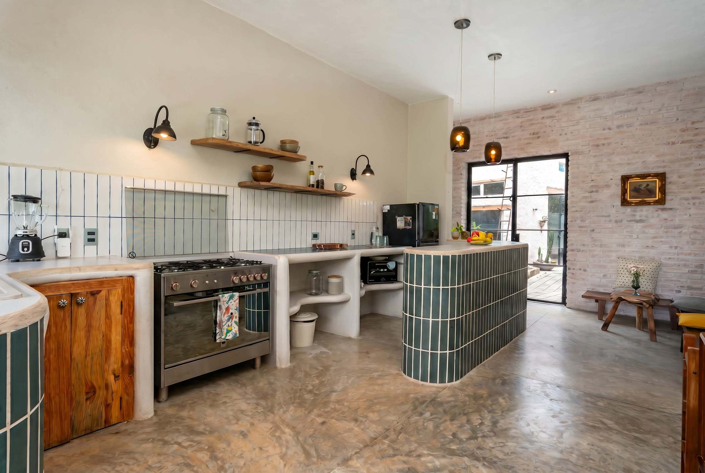 Kitchen with open shelving and garden view