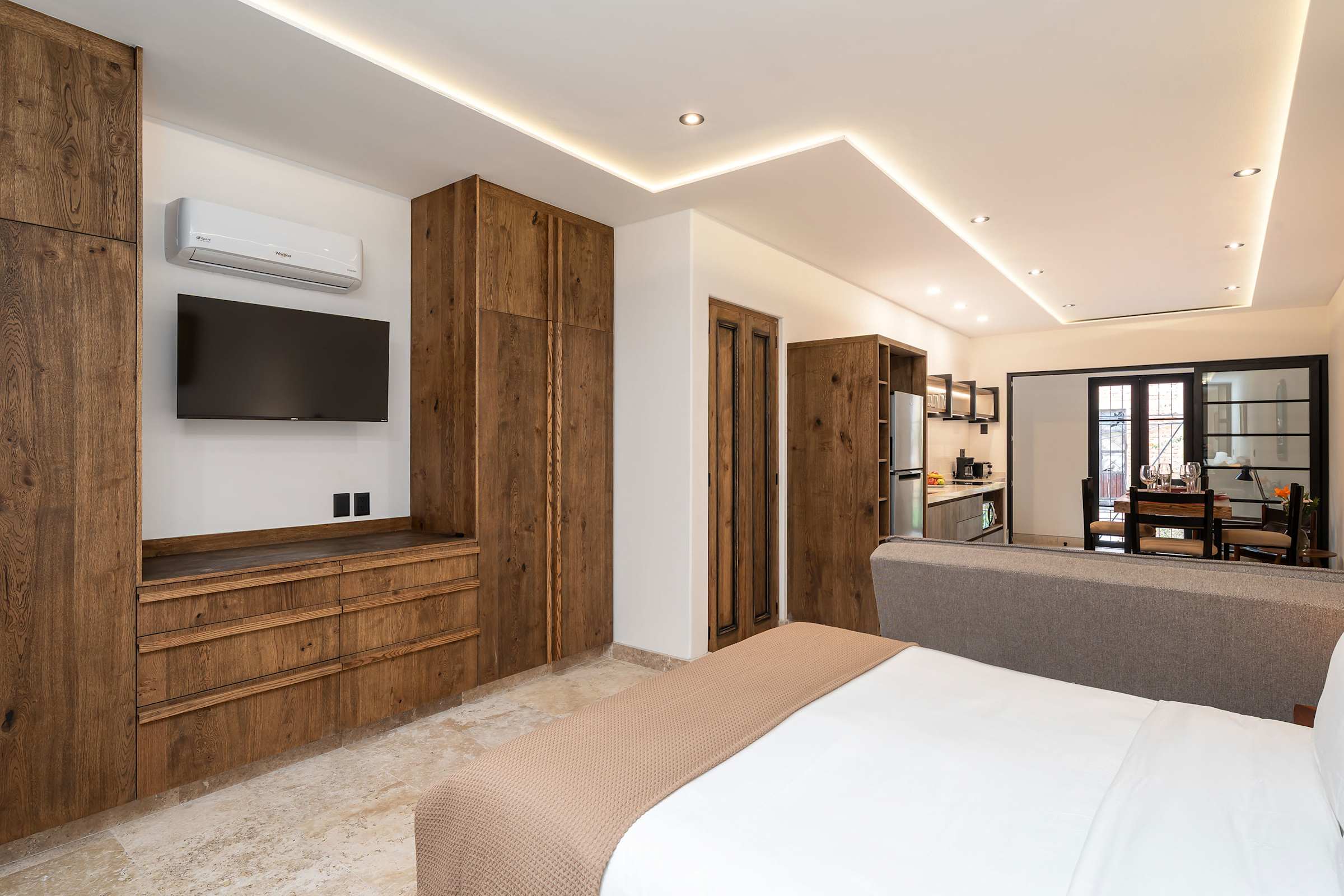 Bedroom with Smart TV, closet space, and air conditioning