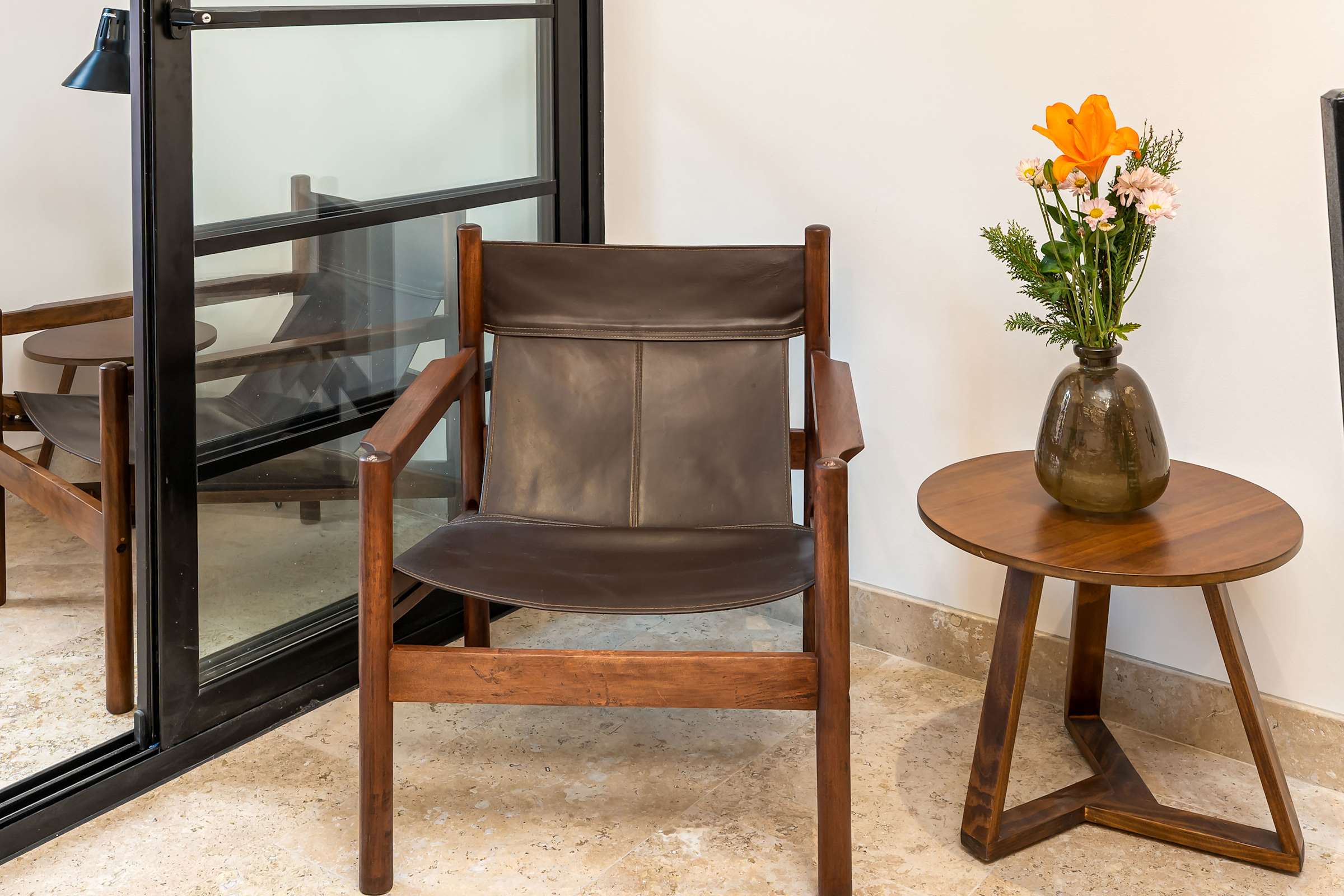 Sitting area with leather chair and side table