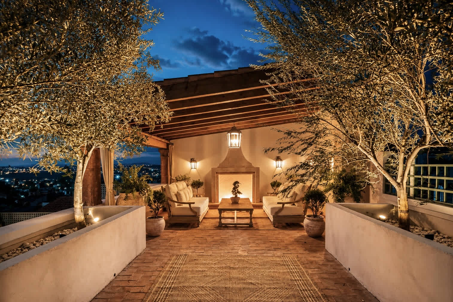 String lights and palapa roof on the rooftop terrace at dusk