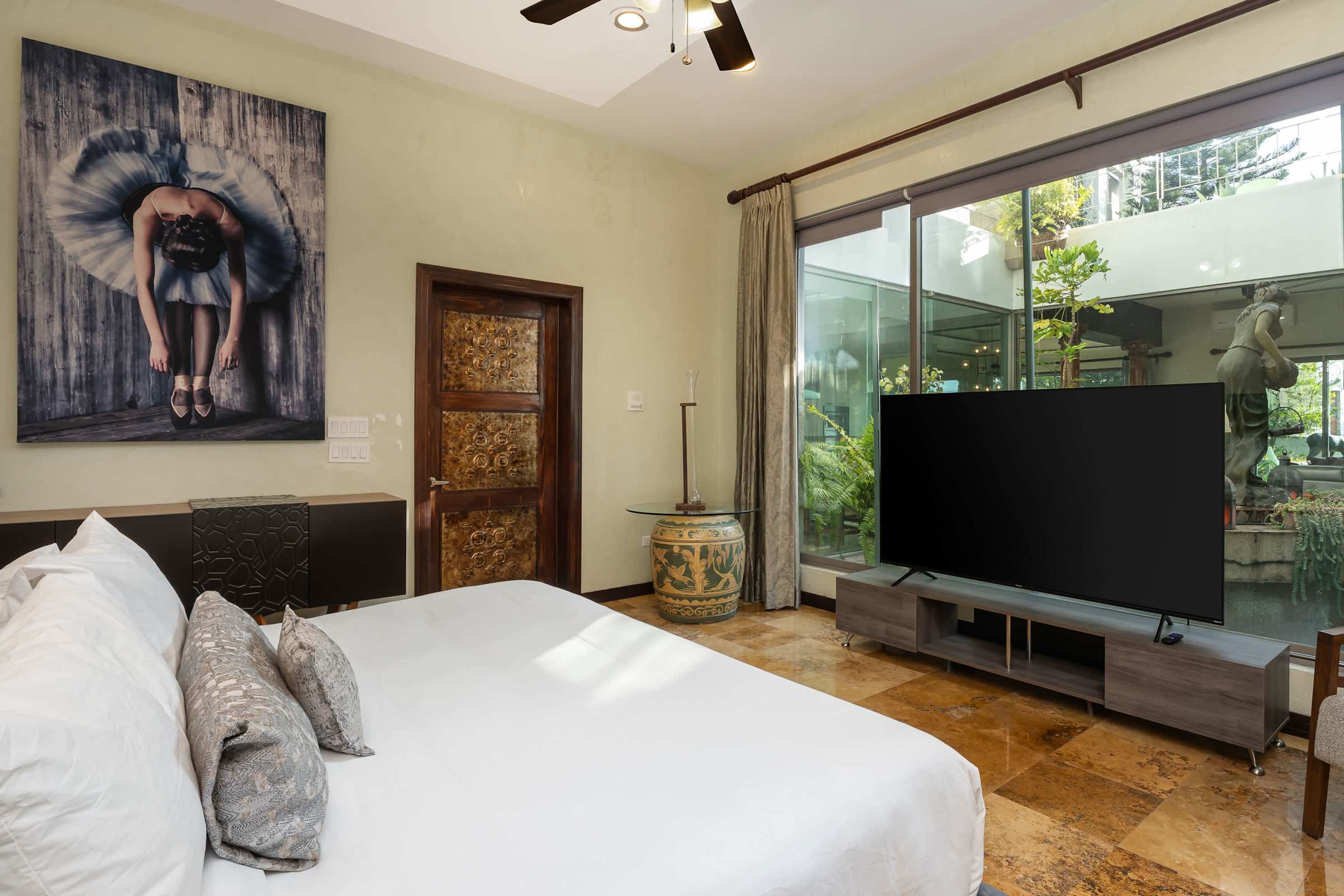 Primary suite bedroom with TV