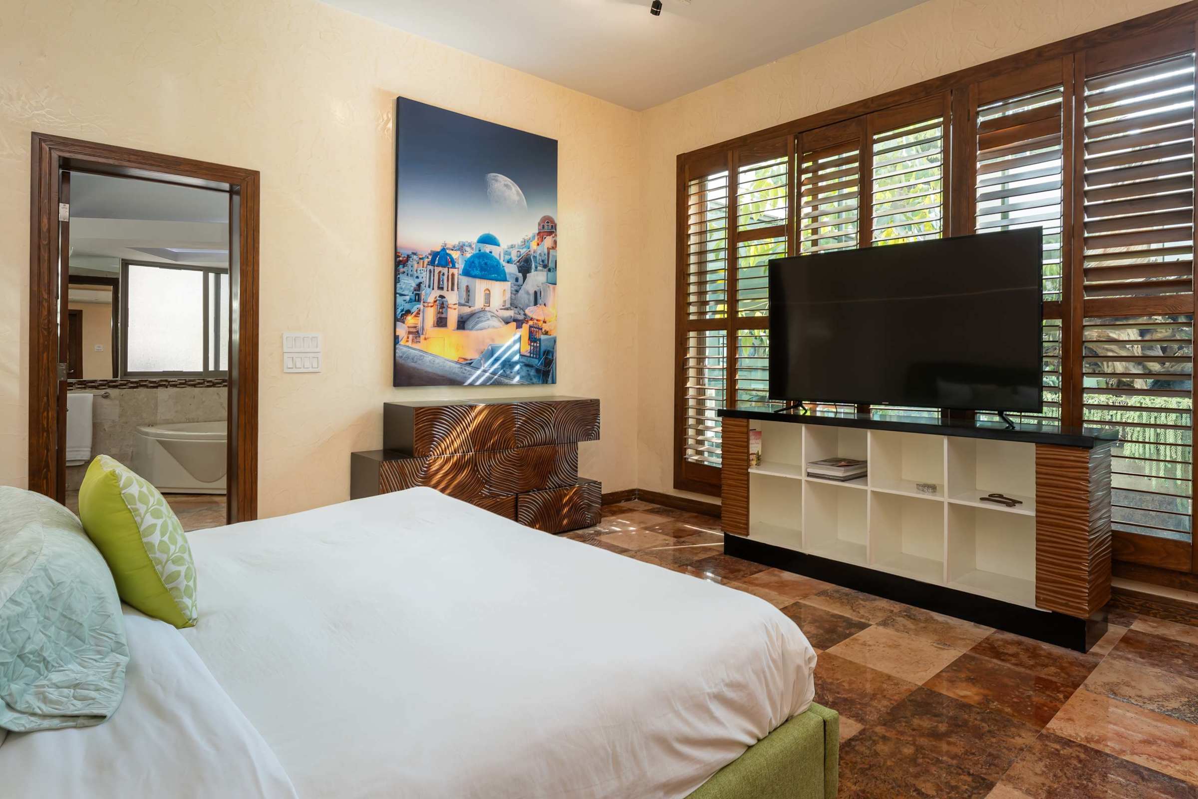 Primary suite king bed with TV
