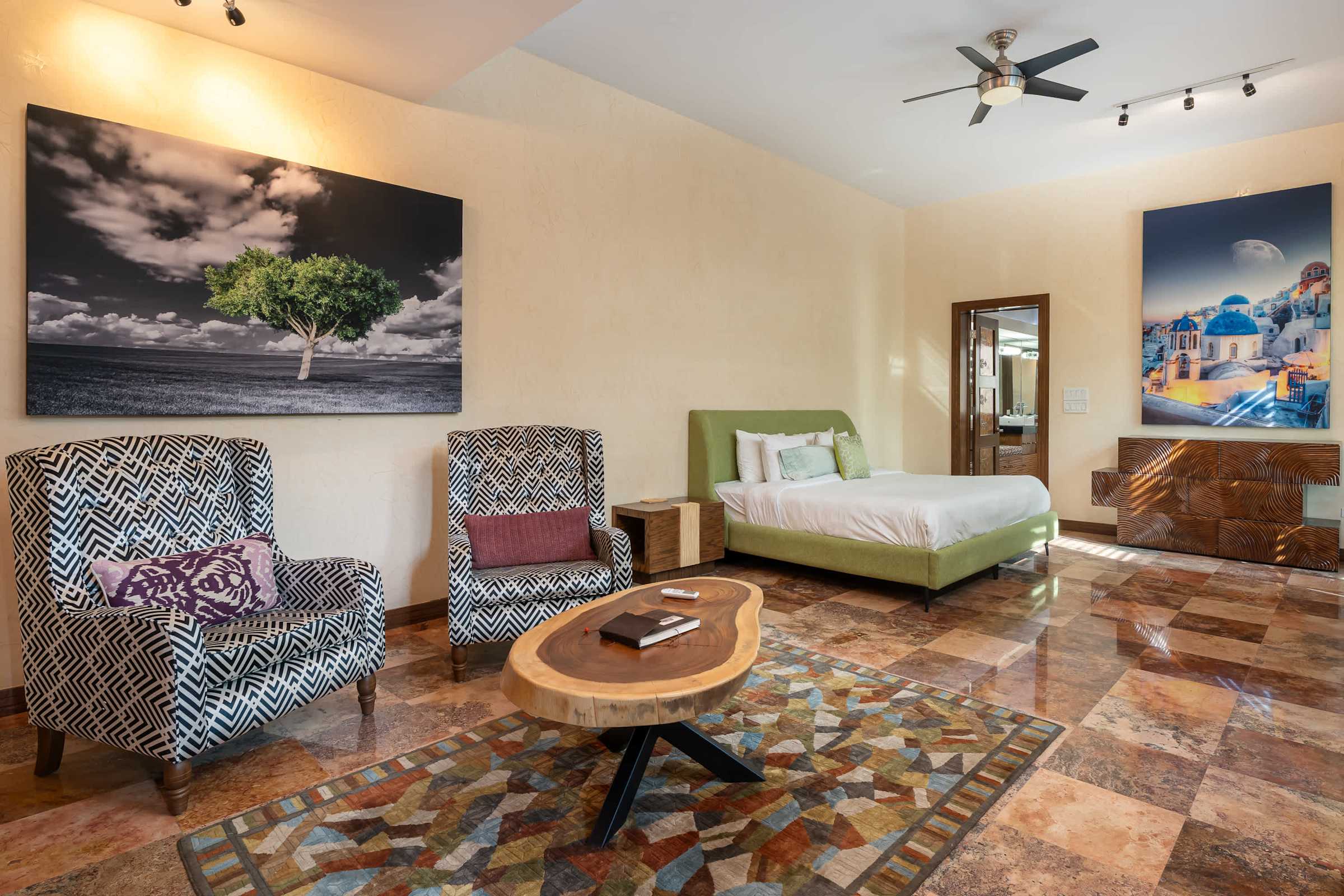 Primary suite with king bed and sitting area
