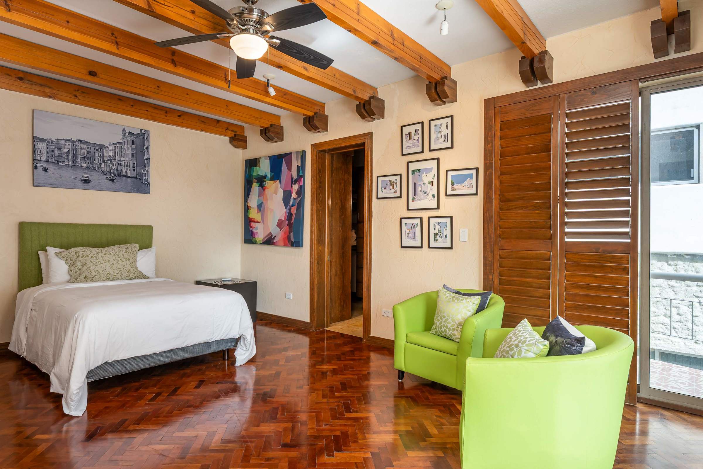 Guest bedroom with double bed, seating area and ensuite bathroom