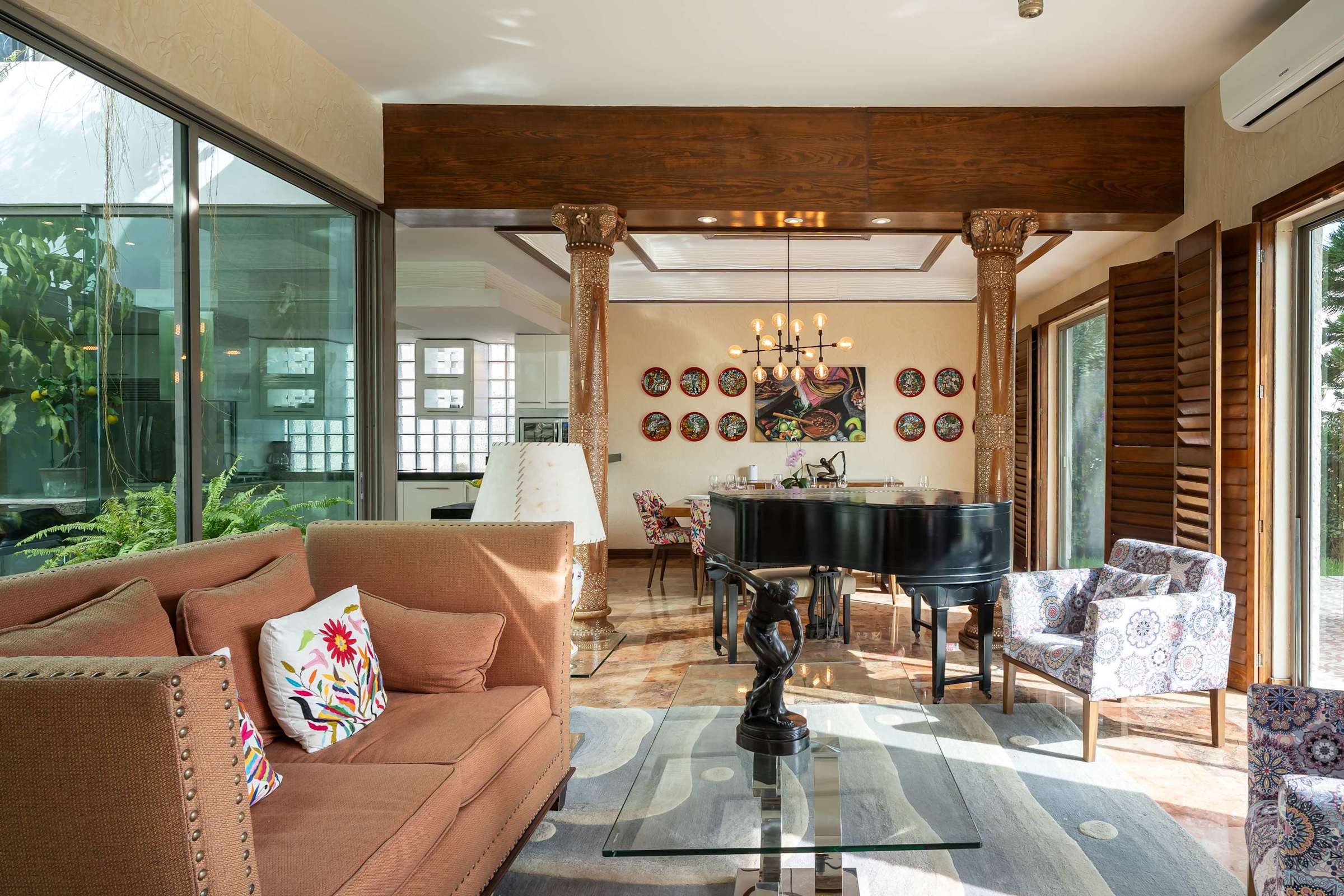 Living room with piano and wood columns