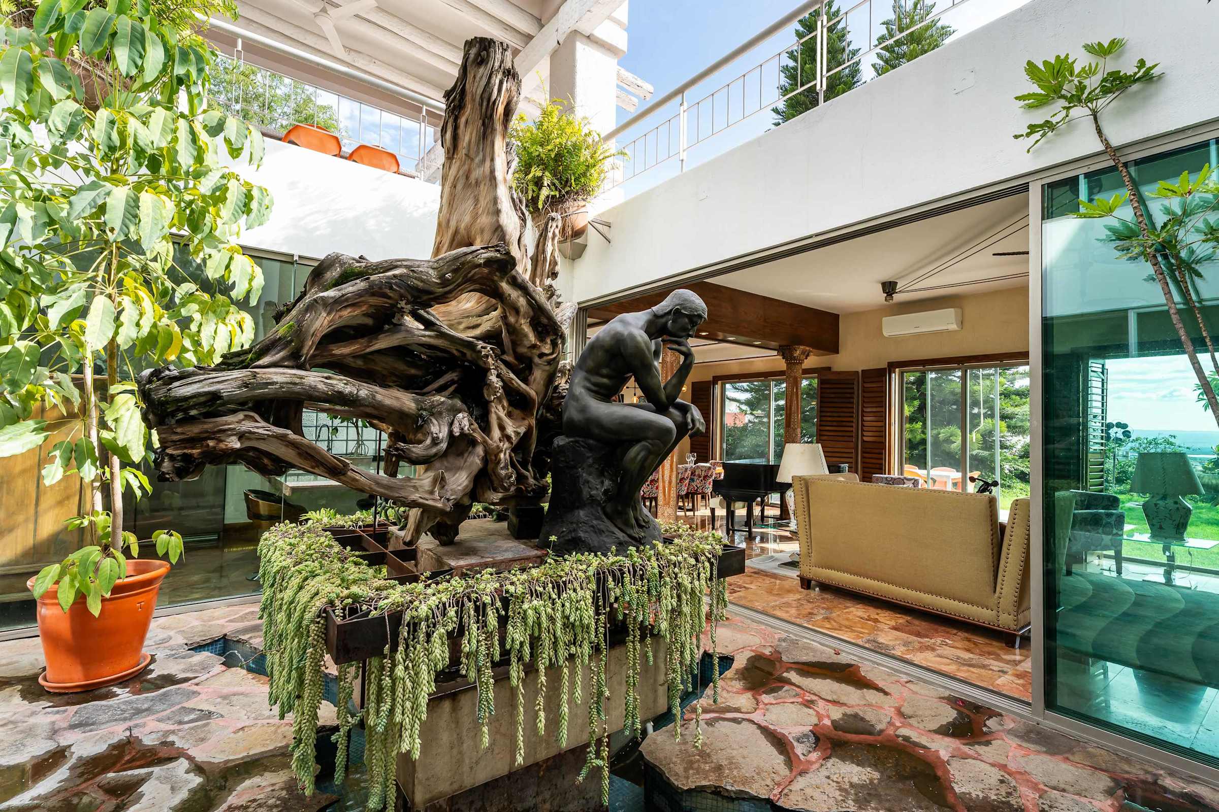 Inner patio sunroom with sculpture near the living room
