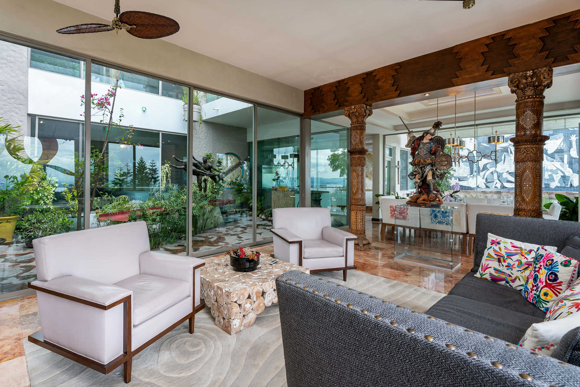 Living room seating area with armchairs and patterned textiles
