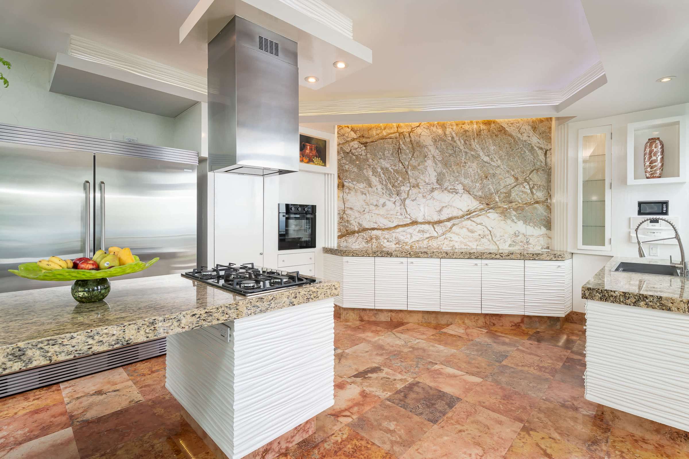 Kitchen with white cabinetry and granite counters