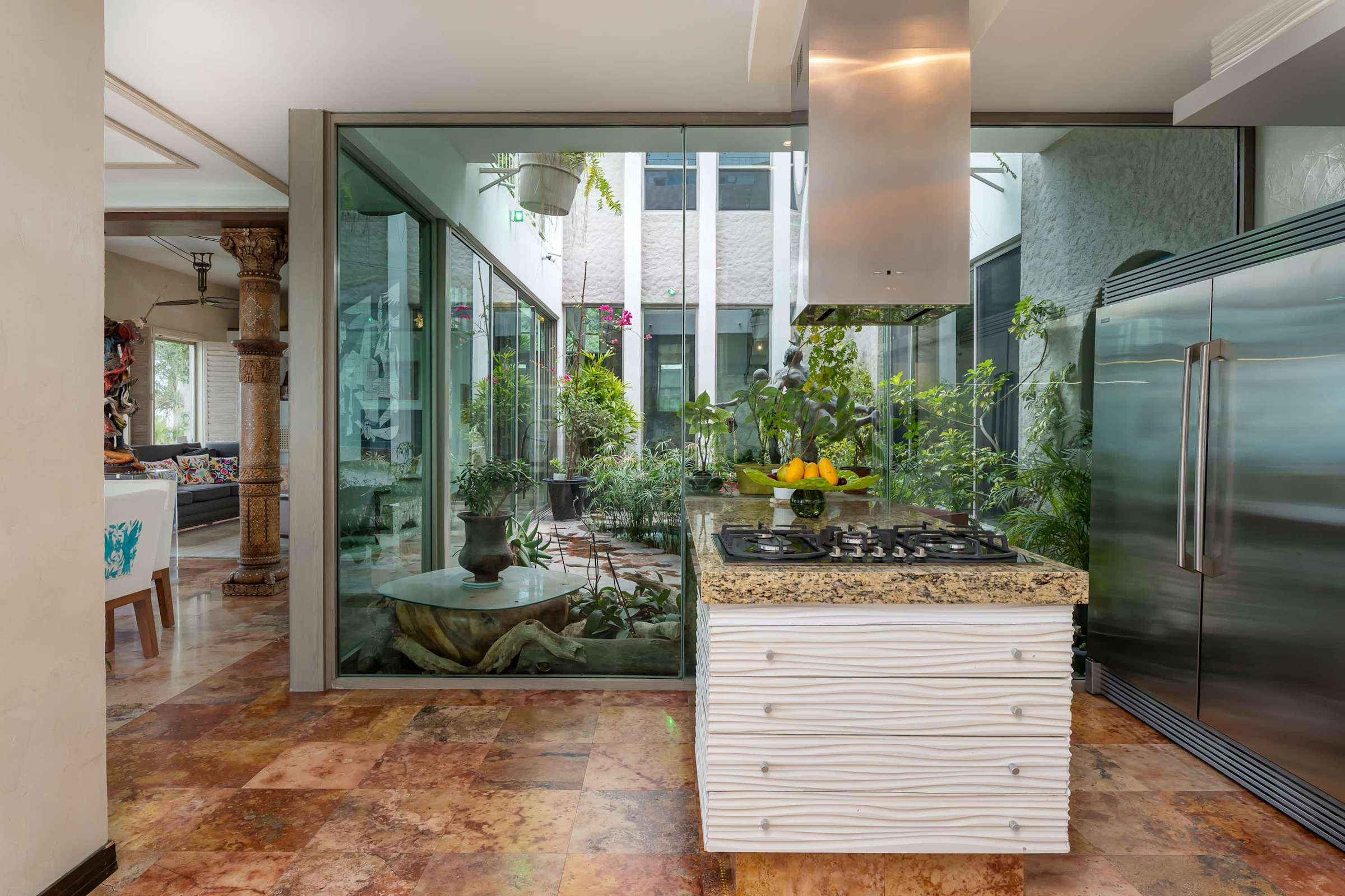Kitchen with glass wall overlooking the inner courtyard garden