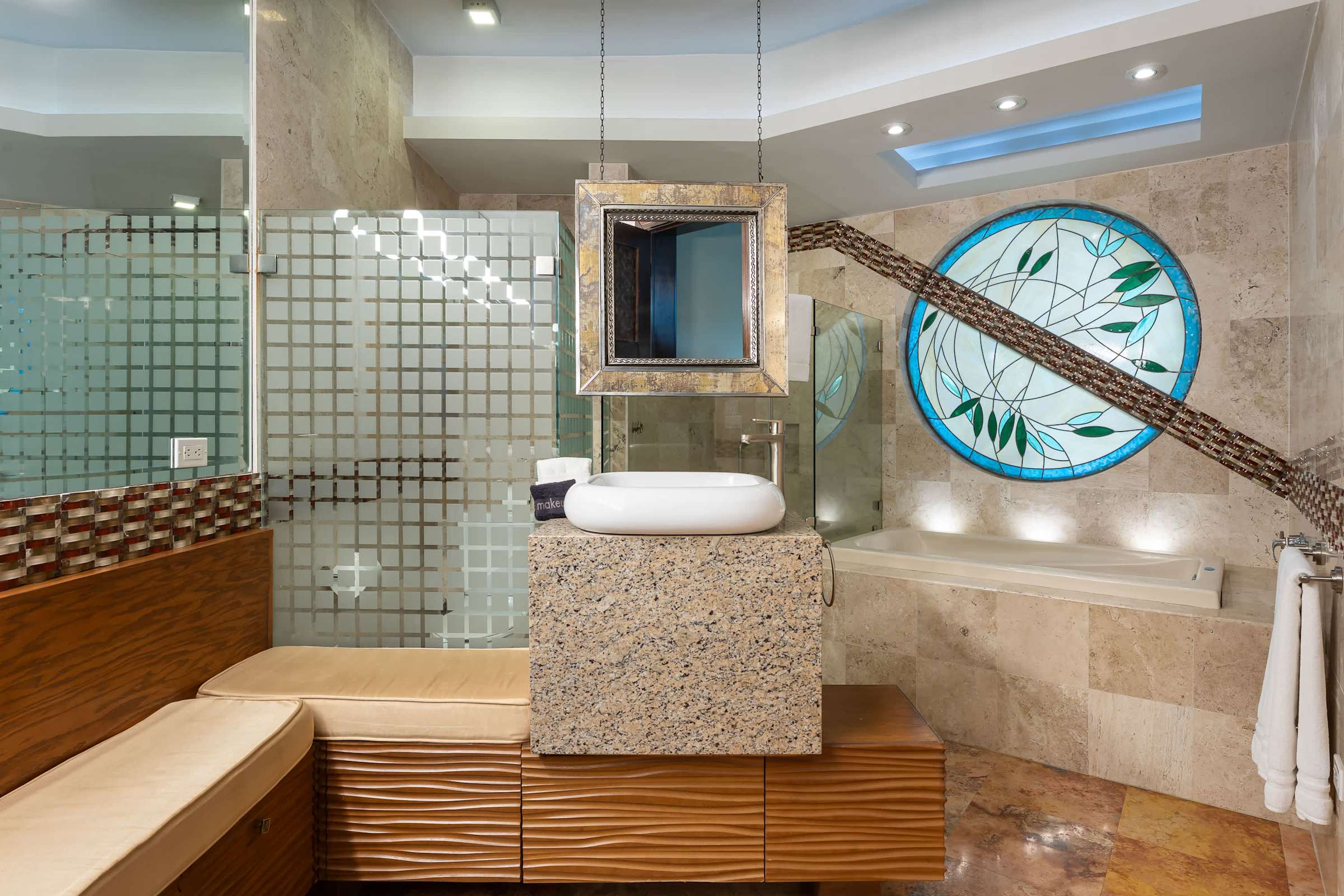 Primary ensuite bathroom vanity with stained glass window